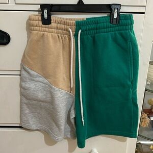 Tan, grey and green baggy sweatpant shorts.